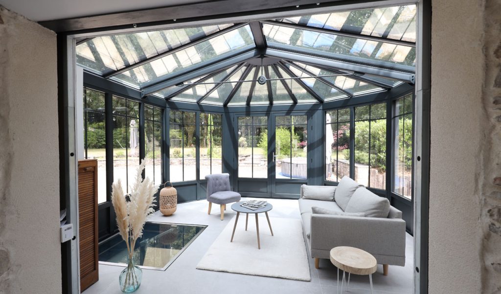 Rénoval véranda salon style atelier maison ancienne